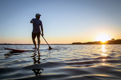 man paddleboarding