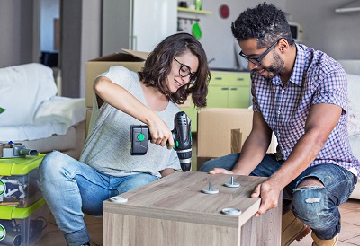 couple putting together furniture