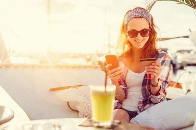 woman shopping with credit card and smartphone