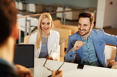 professional couple consulting with advisor